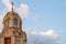 Orthodox chapel against the background of a blue sky and heap of beautiful clouds.