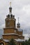 Orthodox Christian Cathedral with golden domes and crosses against the sky, spring day. Tserkov` Smch.kharlampiya, Tsivilsk,