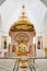 Orthodox church with altar behind iconostasis, pulpit and font for baptism