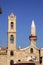 Orthodox church bell tower next to the mosque minaret, Limassol, Cyprus