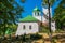 Orthodox Church with green domes and white walls. Monastery