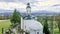 Orthodox church landscape in winter time with mountains covered with snow on cloudy day back view religious background