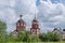 Orthodox Church of Presentation of the Lord with bell tower and spire and gilded Orthodox. On right is the Sunday school.