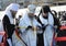 Orthodox Church priest Metropolitan Onufriy blessing people by holy water during ceremony of Great Blessing Of Waters