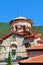 Orthodox Church in the reconstruction on the background of the mountains