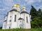 The Orthodox Church of St. Catherine, a resplendent white church with gilded domes and crosses, as it stands in perfect harmony