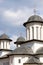 Orthodox church steeples and towers against cloudy sky