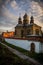 Orthodox church at sunset in the city landscape