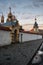 Orthodox church at sunset in the city landscape