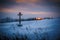 Orthodox cross in a field in winter