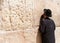 Orthodox Jewish Man prays at the western wall