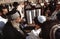 Orthodox jewish men pray at the Western Wall