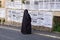 Orthodox jewish `Taliban women` read street poster in jewish quarter