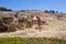 Orthodox Jews praying on the Mount of Olives cemetery and Tomb of Absalom son of King David of Israel and ancient jewish in