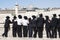 Orthodox Jews stand in front of the Western Wall.