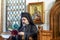 The Orthodox metropolitan bishop is reading holy liturgy book