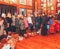 Orthodox priest consecrates holy water with Easter cakes and eggs in a wooden church