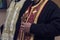 Orthodox priest holds a wooden cross in his hand