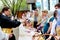 An Orthodox priest sprinkles Christians with Holy water and illuminates the traditional Easter meal of parishioners before the