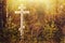 Orthodox worship cross in the forest on the side of the road at the entrance of the village in autumn