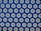 Orthopedic massage blue mat with white spikes. Close-up top view. Alternative medicine for babies, kids and adults.