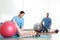 Orthopedists working with children in hospital gym