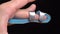 Orthosis on the finger on black background. Fixation of the damaged joint of the finger. Finger injury or arthritis