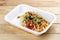 Ortolana pasta with vegetable sautÃ©. Healthy food. Takeaway food. On a wooden background