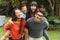 ortrait of happy asian parents, son and daughter smiling outdoors in garden