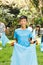 ortrait of smiling asian son, collecting rubbish in sacks with family in the countryside