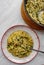 Orzo pasta vith green vegetables. Vegetarian creamy orzo cooked rissoto style