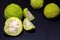 Osage Oranges Maclura isolated on black background. Ð¡ut in half