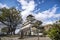 Osaka castle in Japan with light blue sky