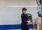 Osaka / Japan - December 20, 2017: Female Train station staff officer of Central Japan Railway Company in front of the shinkansen