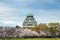 Osaka, Japan at Osaka Castle during the spring cherry blossom season