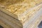 OSB - Oriented strand board. Stacked OSB sheets. Sheet material for the construction of frame houses