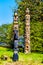 The `Oscar Maltipi Totem Pole` and `Beaver Crest Totem Pole` in Stanley Park.