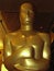 Oscar statue in close up and partial silhouette