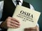 OSHA Occupational Safety & Health Act in the hand