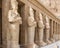 Osiride statues stand in front of the columns at the Mortuary Temple of Hatshepsut