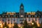 Oslo, Norway. Building Of Grand Hotel Oslo In Night View. Centrum District In Summer Evening.