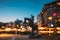 Oslo, Norway. Night Abstract Boke Bokeh Background Effect. Horse Statue On The Street And Residential Multi-storey