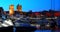 Oslo, Norway. Night View Embankment, Oslo City Hall And Moored Yachts Near Aker Brygge District. Summer Evening. Famous