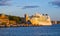 Oslo, Norway - Panoramic view of Oslo waterfront with Aker Brygge Oslo castle fortress and giant cruiser ship docked at Pipervika