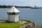 OSLO, NORWAY â€“ JULY 11, 2022: Oslo harbor, navigation marker on the land and all electric ferry in the water