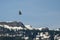 Osprey Flying High Over the Snow Covered Mountains