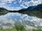 Ossiacher Lake in Carinthia, Austria on a summer day with great cloudscape being reflected in the Lake