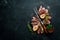 Osso buco cooked Veal shank on a black background. Top view.