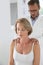 Osteopath fixing woman\'s posture