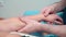 Osteopathic orthopedist makes massage therapy for restoring the arm of the hand after an injury. Physiotherapy of a